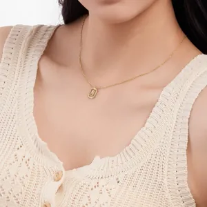 Dainty gold-plated initial H necklace detail on model, elegant S925 silver jewelry.
