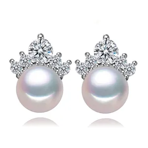 Detailed macro view showing the crown zircon setting and freshwater pearl of 8mm stud earrings