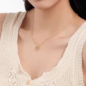Detailed view of dainty gold-plated S925 silver necklace with letter pendant