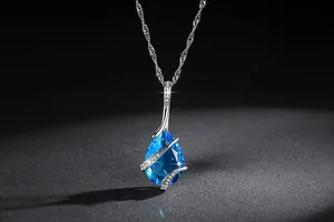 Detailed view of elegant blue teardrop zircon necklace with silver wrap setting