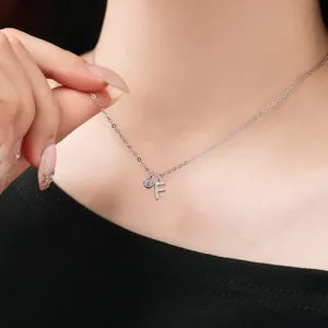 Detail view of S925 sterling silver necklace with letter F and crystal pendant