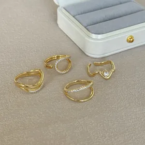 Collection of S925 sterling silver irregular stackable rings with gold plating