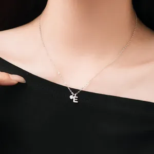 Close-up of S925 sterling silver initial E necklace with sparkling crystal pendant