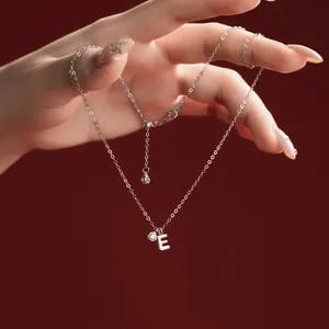 Detailed view of S925 sterling silver necklace with letter E pendant and crystal