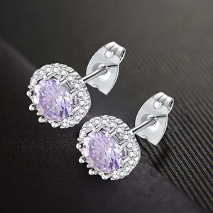 Elegant round purple cubic zirconia halo stud earrings with brilliant silver finish.