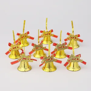 Set of nine golden Christmas bells with red bows and Merry Christmas lettering detail