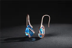 Elegant rose gold waterdrop earrings featuring sea blue stones and sparkling zircon accents.