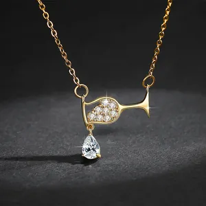 Close-up of elegant water drop wine glass pendant necklace with sparkling zircons
