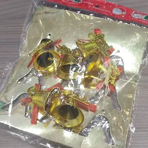9-pack gold Christmas bell ornaments with red bows and Merry Christmas script