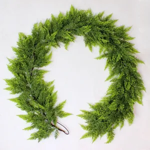 Close-up view of a flexible artificial cedar garland used for Christmas wall decoration.