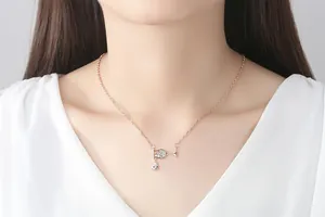 Detailed view of elegant rose gold wine glass necklace with sparkling zircon droplets