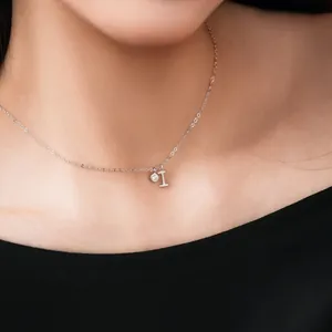 Close-up of S925 sterling silver necklace with initial L pendant and small zircon