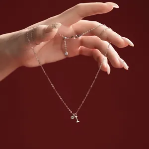 Close-up of elegant S925 sterling silver necklace with initial I pendant detail