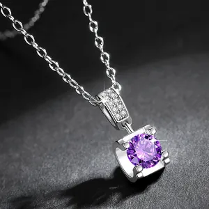 Macro detail of elegant purple zircon pendant featuring a classic bull-head setting design