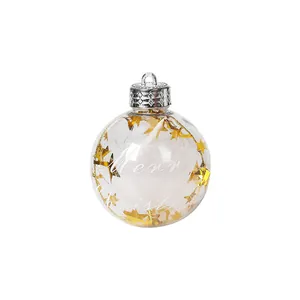 Bola de Navidad transparente de 8cm con estrellas doradas y relleno de plumas
