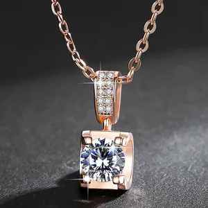 Detailed close-up of a rose gold pendant featuring a brilliant round cubic zirconia stone.