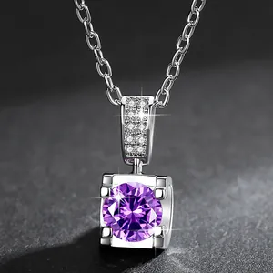 Close-up of elegant silver ox head pendant with brilliant faceted purple zirconia.