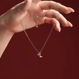 Detailed view of S925 sterling silver necklace featuring a sparkling letter L pendant