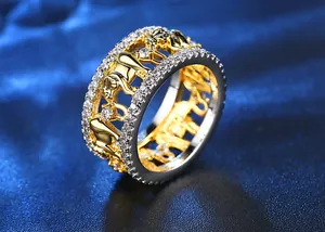 Macro detail of a two-tone gold and silver elephant ring set with sparkling crystals