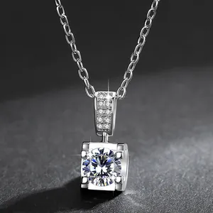 Close-up of a sparkling silver-colored bull-head pendant necklace with brilliant stone.