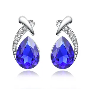 Elegant silver stud earrings featuring blue pear-shaped crystals and small accents