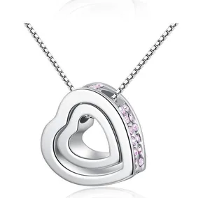 Close-up of elegant silver double heart necklace with pink sparkling gemstones