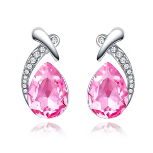 Detailed view of elegant pear-shaped pink crystal stud earrings with silver accents
