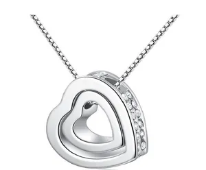 Close-up detail of silver double heart necklace with side-set rhinestones in white