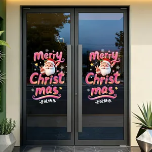 Detailansicht der bunten Weihnachtsmann-Weihnachtsaufkleber auf einer modernen Glastür