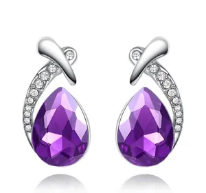 Elegant purple teardrop crystal stud earrings with silver criss-cross detail and gems
