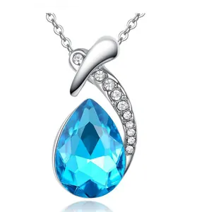Close-up of elegant pear-cut blue crystal pendant with sparkling silver accents