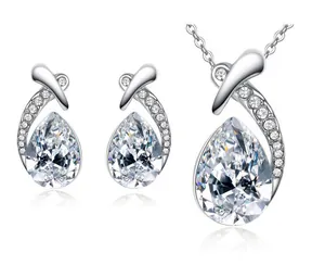 Detailed close-up of brilliant teardrop crystal jewelry set with sparkling pave-set stones
