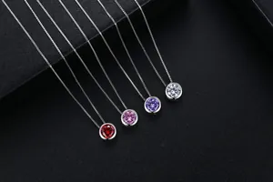 Detailed view of colorful round AAA zircon pendant necklaces with elegant silver box chains.