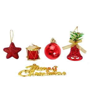 Set de adornos de Navidad rojos y dorados con estrella, tambor, bola, campana y letrero