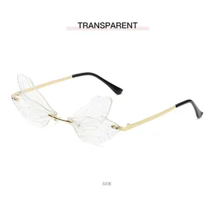 Side view of oversized dragonfly wing sunglasses with transparent lenses and gold frame