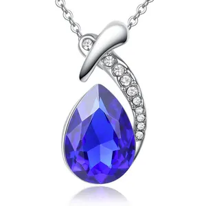 Elegant silver necklace featuring a vivid blue teardrop-shaped crystal pendant