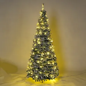 Slim flocked Christmas tree with warm yellow LED lights for festive indoor decoration