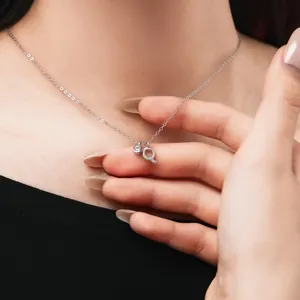 Detail view of S925 sterling silver necklace with letter Q and cubic zirconia charms