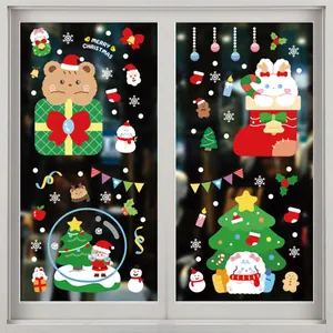 Close-up of Christmas static stickers showing festive characters on glass window
