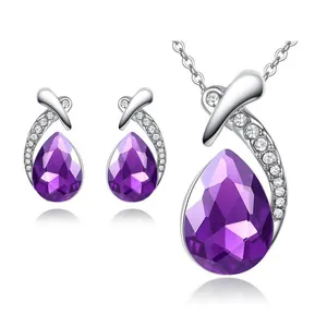 Purple teardrop crystal jewelry set with necklace and earrings on white background