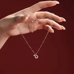 Macro view of S925 sterling silver necklace with O-shaped pendant and zircon