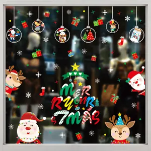 Detail view of festive Christmas static window stickers on a glass storefront