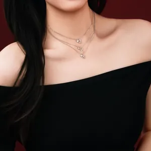 Detailed view of triple-layered S925 silver necklace with CZ letter pendants ZVK