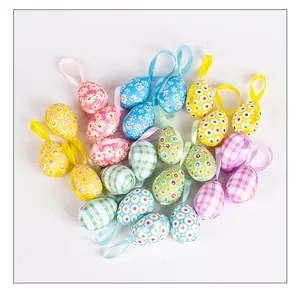 Detailed shot of assorted fabric-covered foam Easter egg ornaments with hanging ribbons