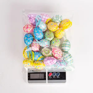 Detailed view of a 30g package containing assorted colorful cloth-wrapped Easter foam eggs