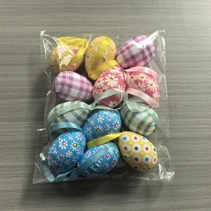 Pack of fabric-covered foam Easter eggs with hanging ribbons in various patterns