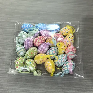 Set of assorted cloth-wrapped foam Easter eggs in transparent bag for party decoration