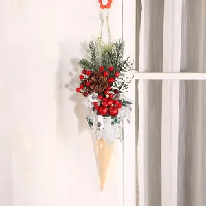 Festive hanging Christmas ice cream cone decoration with LED lights and pine branches