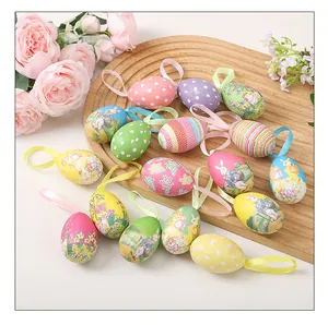 Detail showing variety of colorful Easter painted foam eggs with ribbons on wooden tray