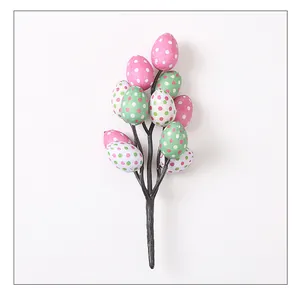 Close-up view of artificial Easter egg branch with vibrant colorful polka dot patterns